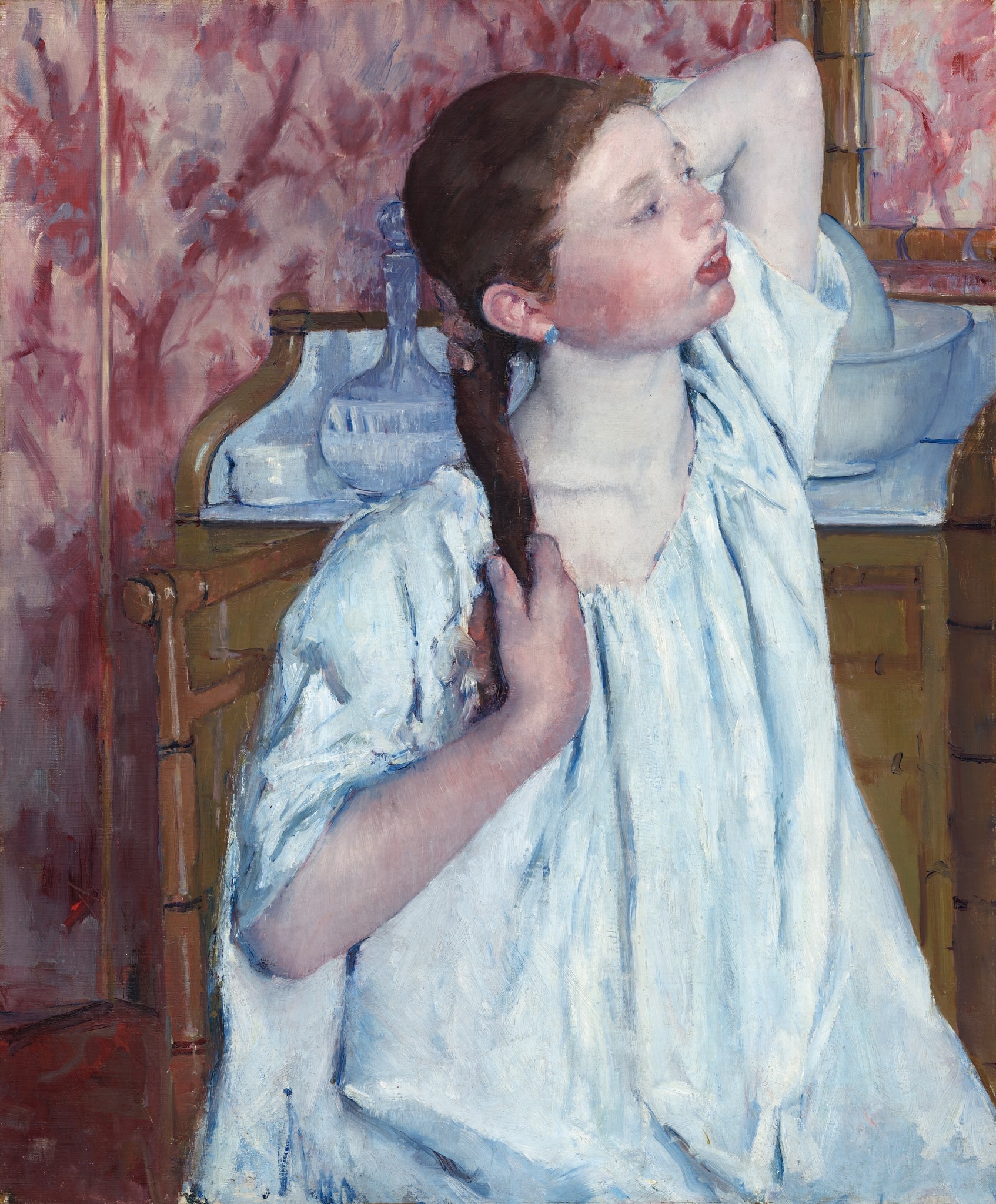 Girl Arranging Her Hair by Mary Cassatt (1886)