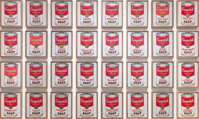 Click numbered symbols to learn about their meaning Campbell's Soup Cans by Andy Warhol (1962) featuring Campbell’s cursive script logo, Red/white split label, Gold medallion seal, Fleur‑de‑lis band
