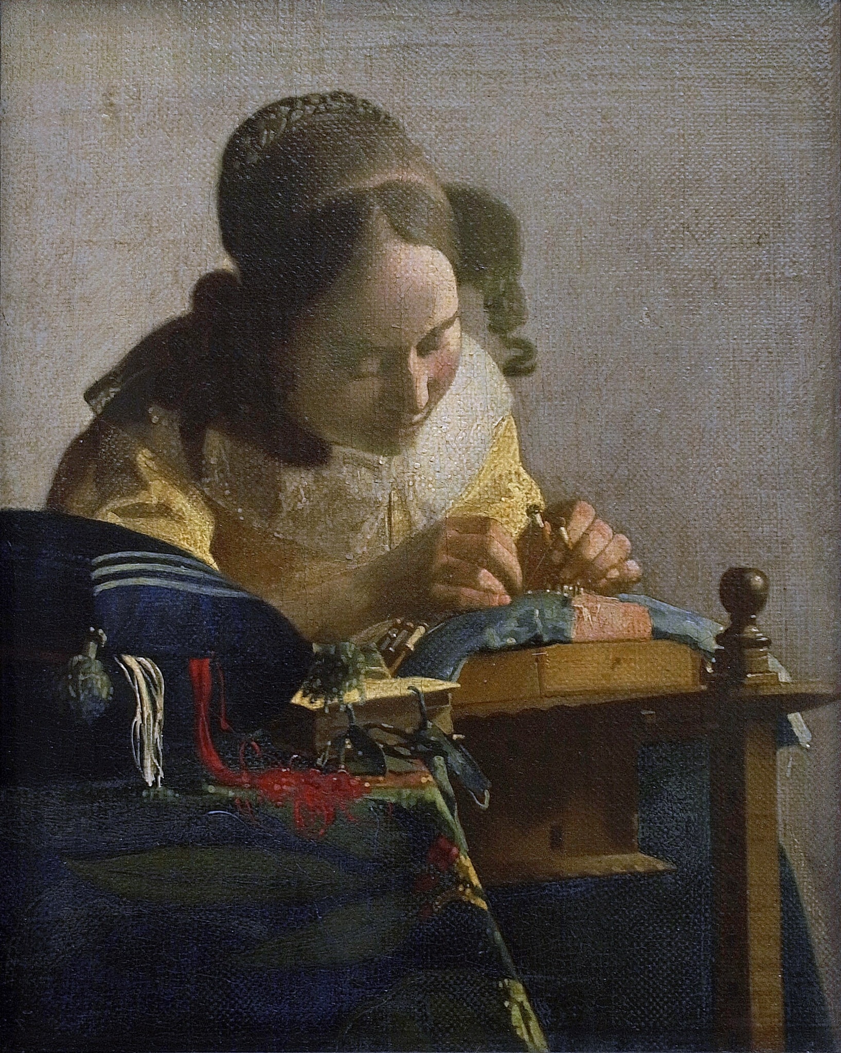 Click numbered symbols to learn about their meaning The Embroiderer by Johannes Vermeer (1669–1670) featuring Lace pillow with bobbins and pins, Tangle of red and white threads