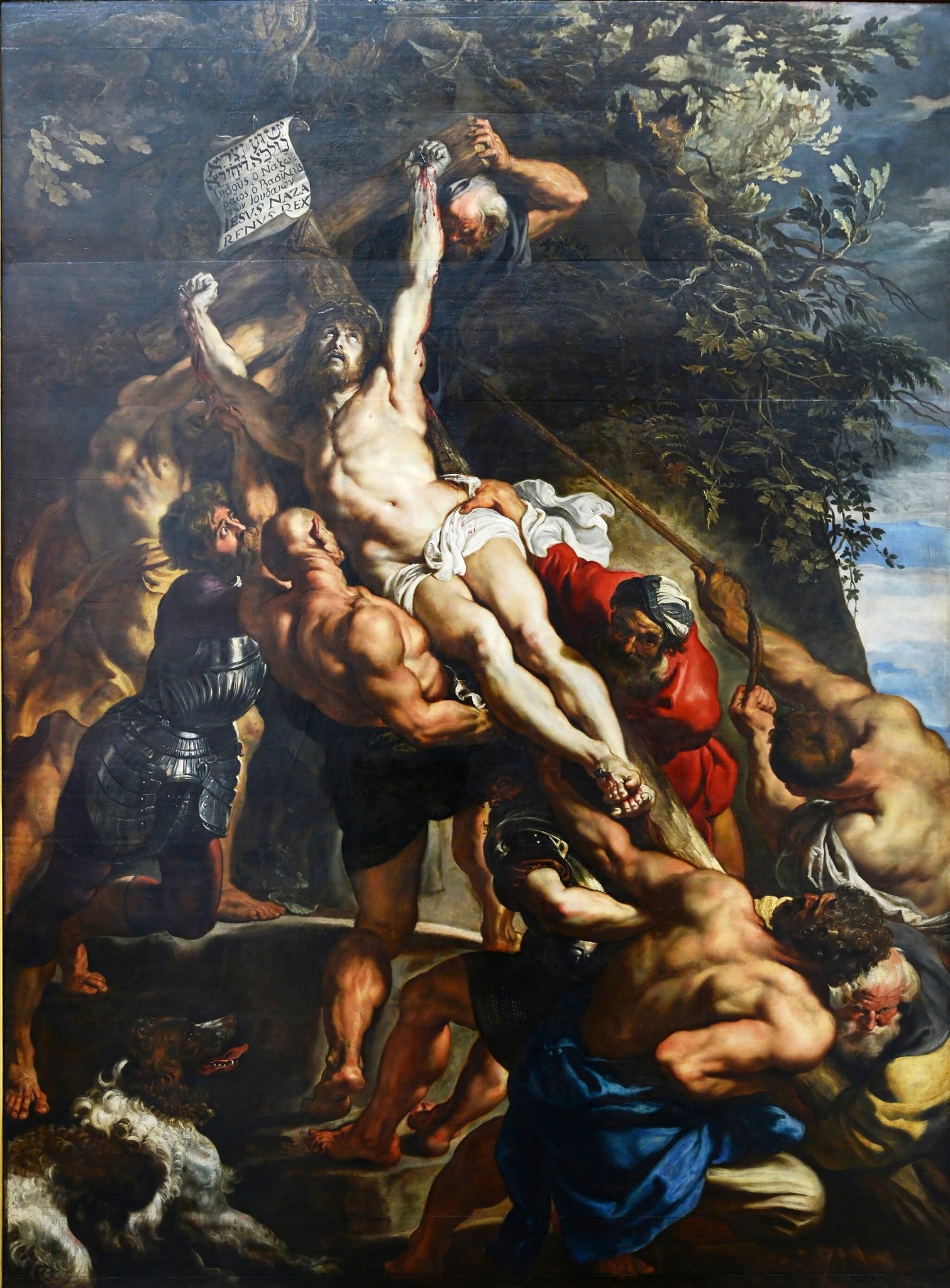 Click numbered symbols to learn about their meaning The Elevation of the Cross by Peter Paul Rubens (1609–1610) featuring INRI placard, Crown of thorns, Divine light on Christ, Ropes and levered cross