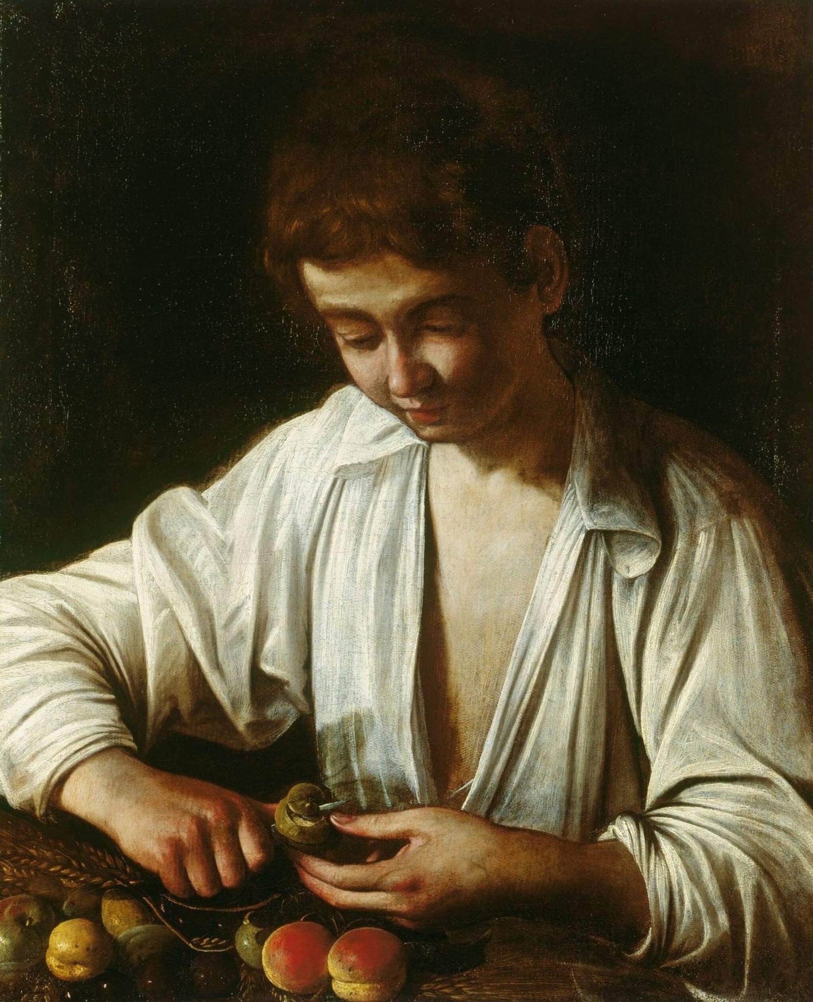 A Boy Peeling a Fruit