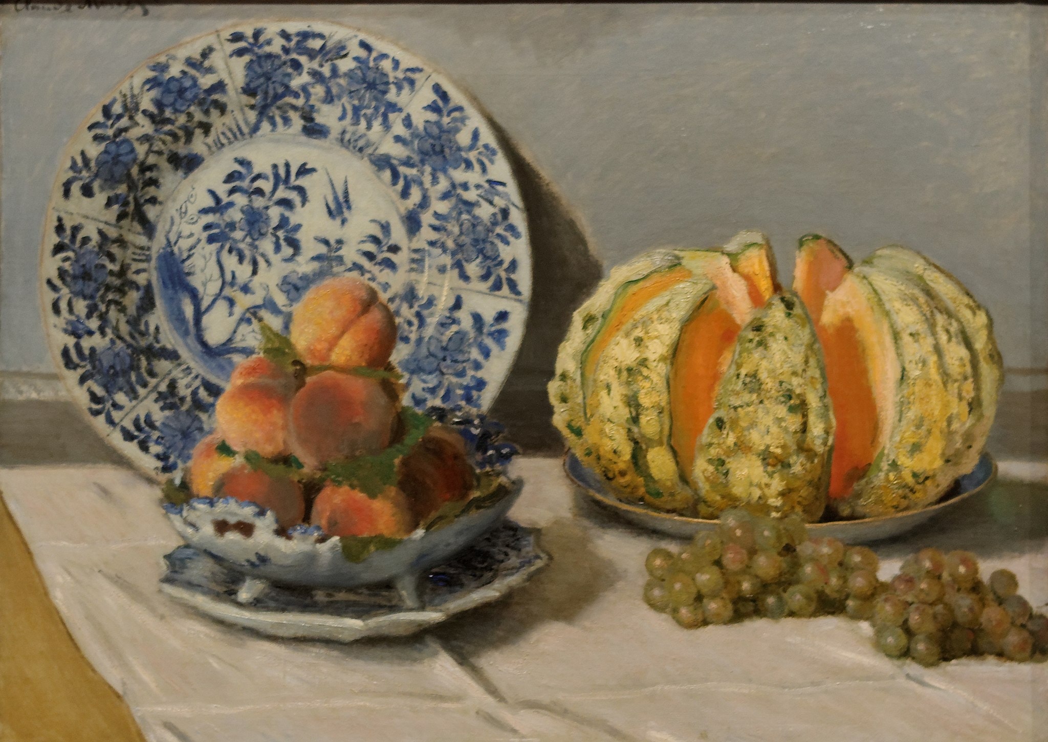 Click numbered symbols to learn about their meaning Still Life by Claude Monet (1872) featuring Blue-and-white porcelain charger, Footed compote dish, Peaches, Cut melon