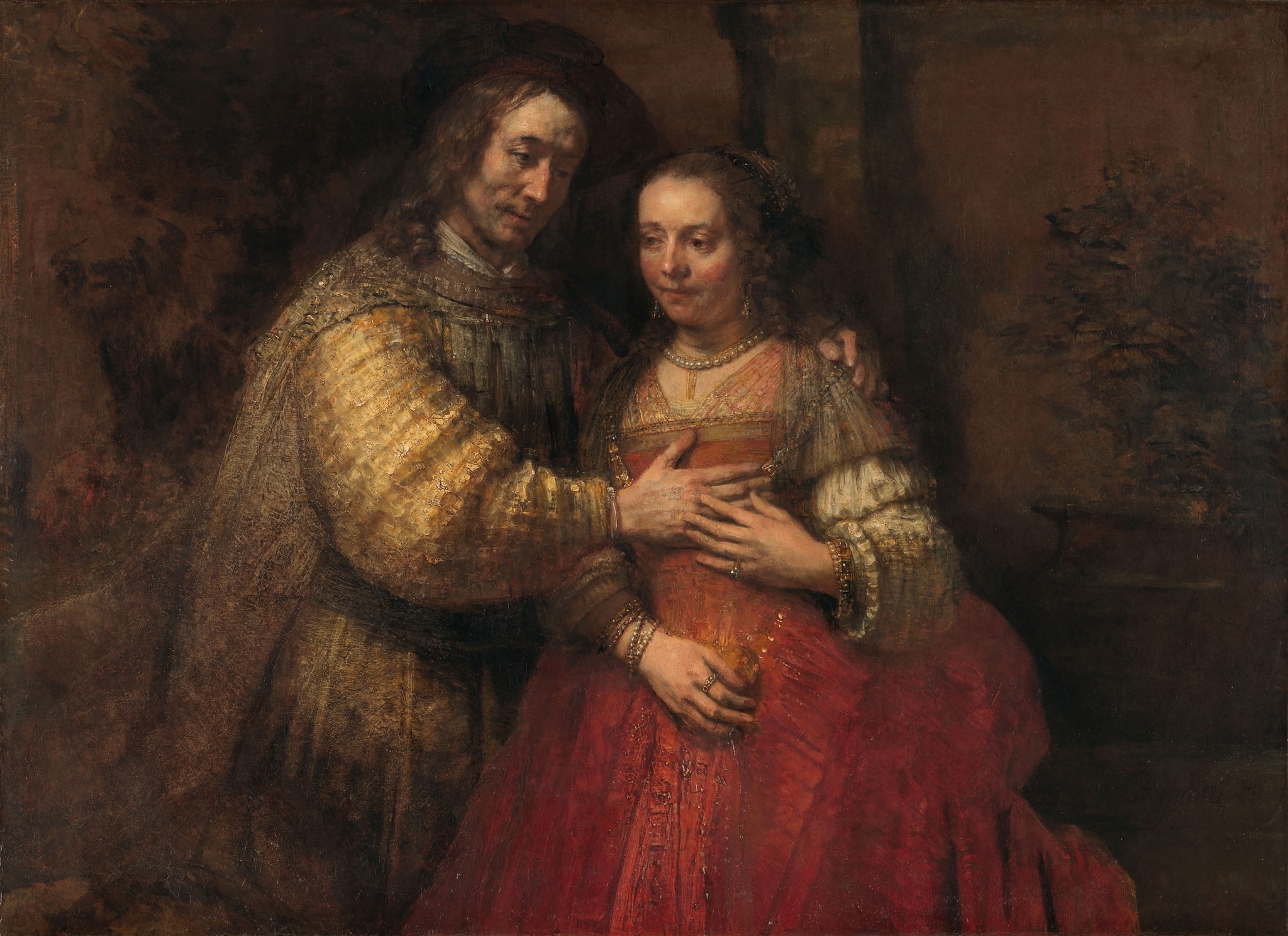 Click numbered symbols to learn about their meaning Isaac and Rebecca, Known as ‘The Jewish Bride’ by Rembrandt van Rijn (c. 1665–1669) featuring Man’s open hand on the woman’s chest, Woman’s hand covering his, Gathered red dress, Hammered-gold sleeve